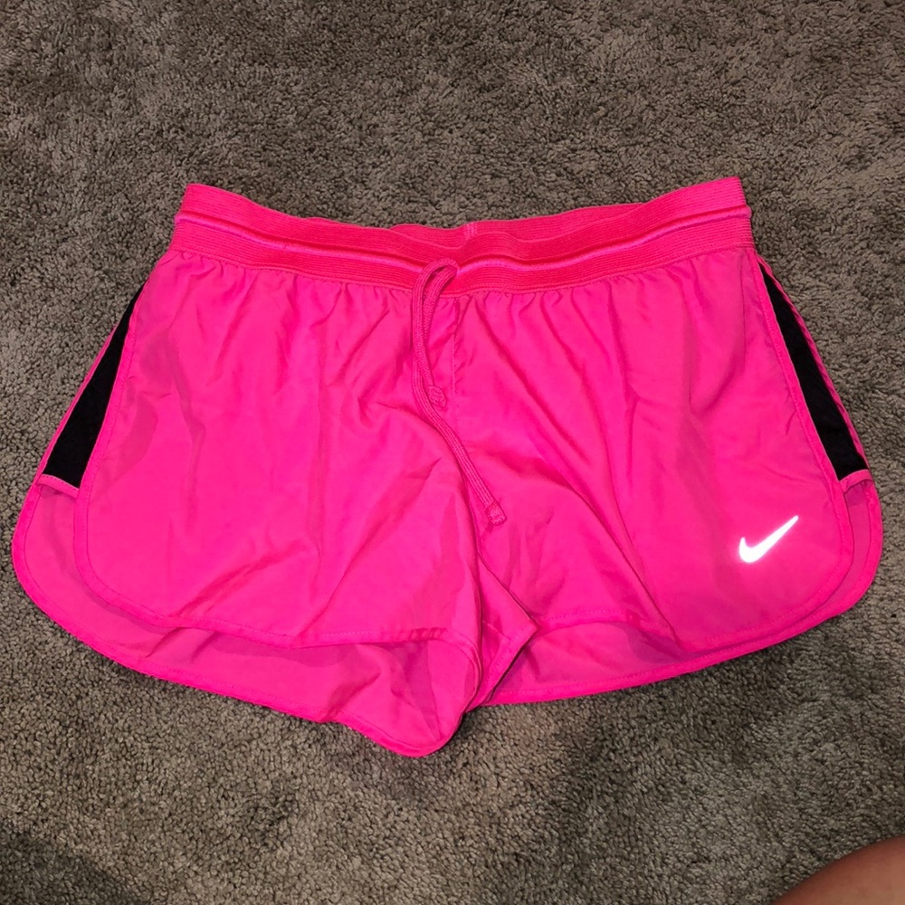 Hot pink Nike running shorts with liner
